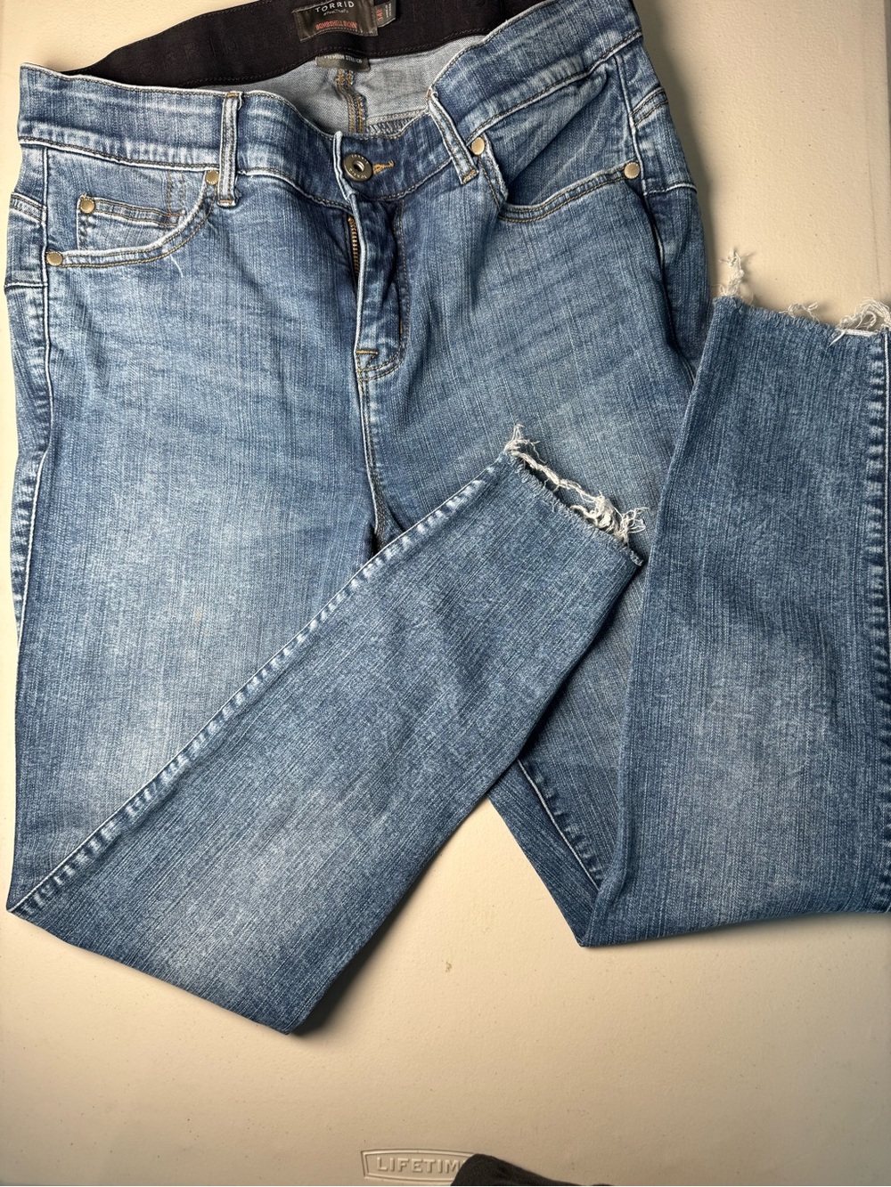 torrid Bombshell Skinny Medium Blue Jeans with Distressed Hem